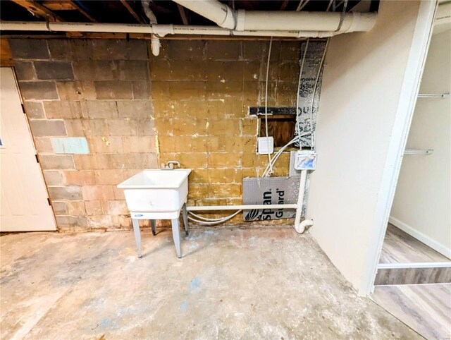 1035 Park Ave, Poplar Bluff, MO 63901 - unfinished basement featuring a sink and concrete block wall