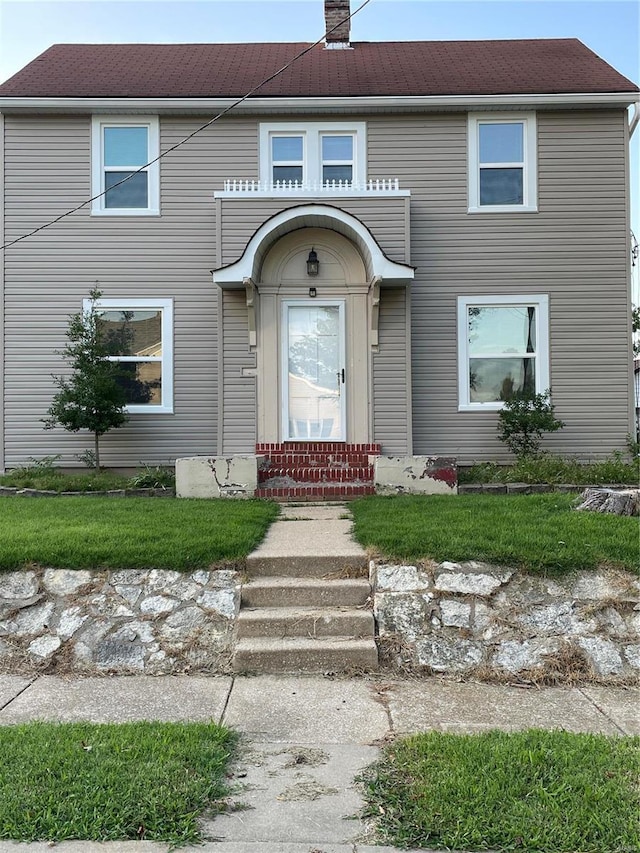 633 E State, Union, MO 63084 - view of front of property with a chimney and a front yard