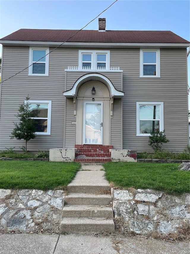 633 E State, Union, MO 63084 - view of front facade with a chimney and a front lawn
