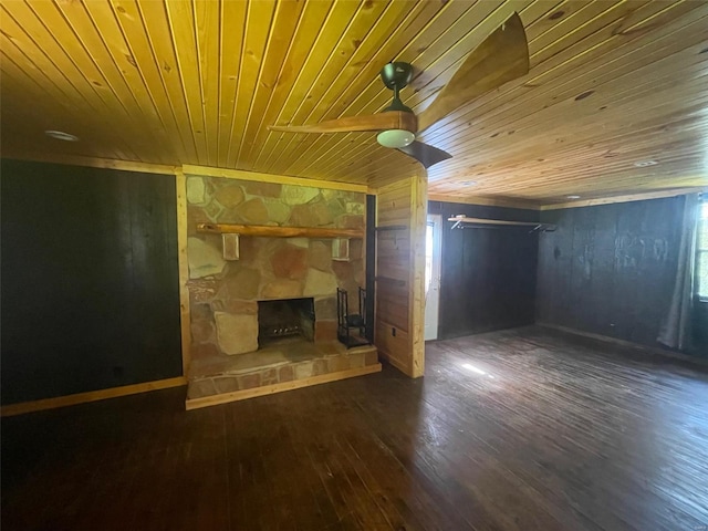 2268 Madison 244, Fredericktown, MO 63645 - unfurnished living room featuring wood ceiling, ceiling fan, a fireplace, wood finished floors, and wooden walls
