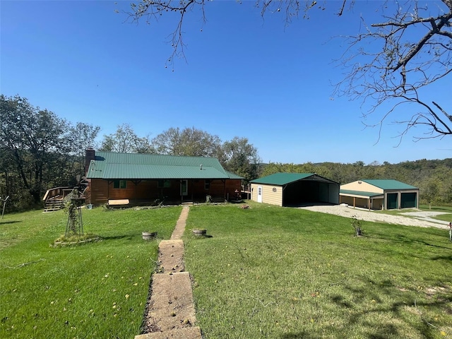 2268 Madison 244, Fredericktown, MO 63645 - view of green lawn with dirt driveway, a pole building, an outdoor structure, and a detached carport