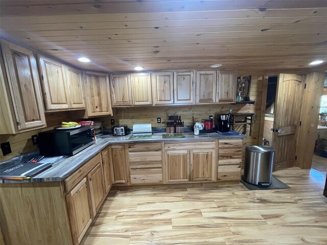 2268 Madison 244, Fredericktown, MO 63645 - kitchen with light wood-style floors, stainless steel microwave, light brown cabinets, and wooden ceiling
