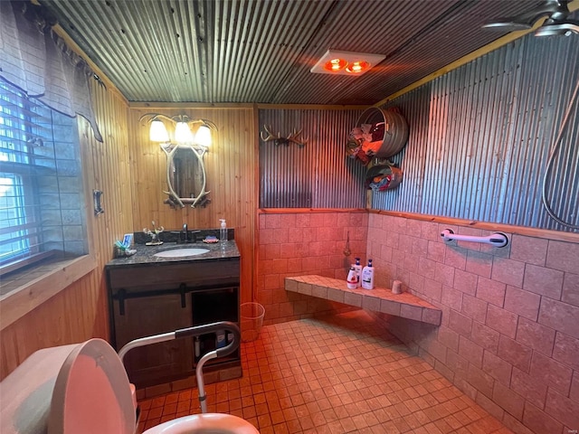 2268 Madison 244, Fredericktown, MO 63645 - bathroom with a wainscoted wall, tile walls, vanity, and tile patterned flooring