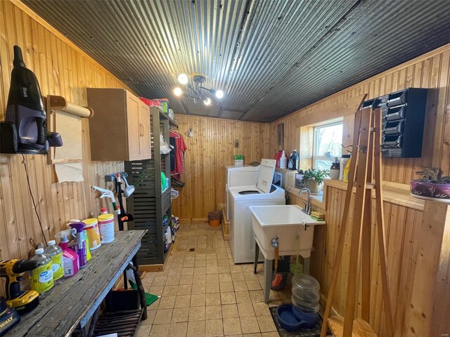2268 Madison 244, Fredericktown, MO 63645 - washroom featuring separate washer and dryer, wooden walls, and light floors