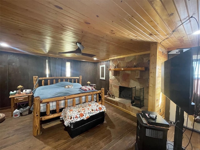 2268 Madison 244, Fredericktown, MO 63645 - bedroom with wood ceiling, wood walls, wood-type flooring, multiple windows, and a fireplace
