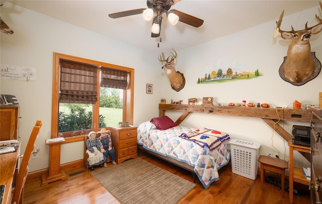 272 NE 1350th Ave, Greenfield, IL 62044 - bedroom with wood-type flooring, ceiling fan, and baseboards