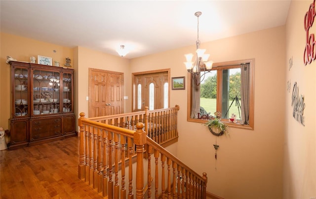 272 NE 1350th Ave, Greenfield, IL 62044 - staircase featuring a chandelier, wood finished floors, and baseboards