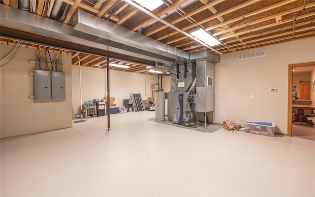 272 NE 1350th Ave, Greenfield, IL 62044 - unfinished basement featuring electric panel, heating unit, and gas water heater