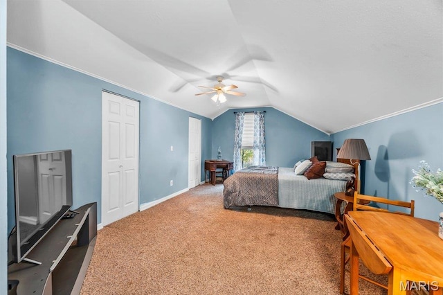 bedroom featuring vaulted ceiling, carpet floors, baseboards, ceiling fan, and ornamental molding