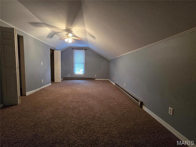 additional living space with a baseboard radiator, a baseboard heating unit, a ceiling fan, vaulted ceiling, and carpet floors