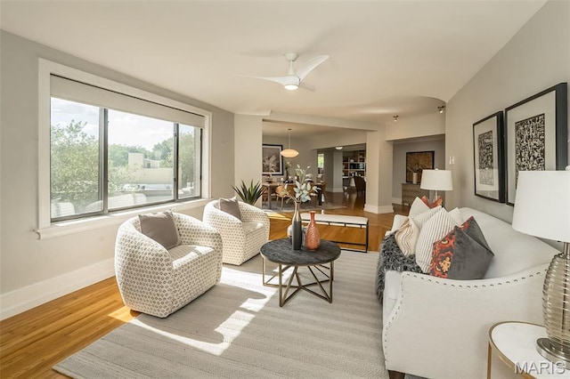 410 N Newstead Ave Unit 6W, Saint Louis, MO 63108 - living area with light wood-style flooring, baseboards, and ceiling fan