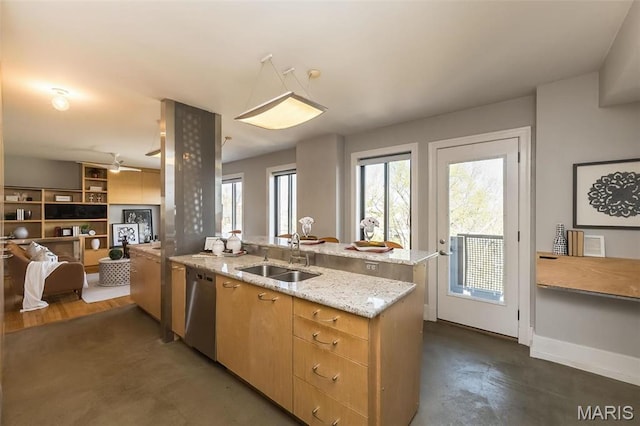 410 N Newstead Ave Unit 6W, Saint Louis, MO 63108 - kitchen with a sink, stainless steel dishwasher, light stone counters, and open floor plan