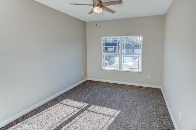 empty room featuring carpet floors, a ceiling fan, and baseboards
