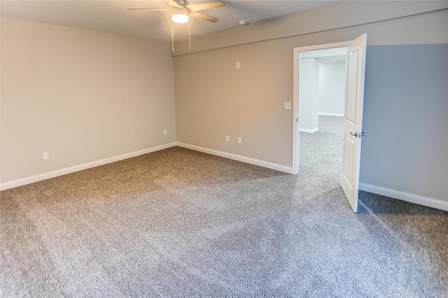 empty room featuring carpet flooring, ceiling fan, and baseboards