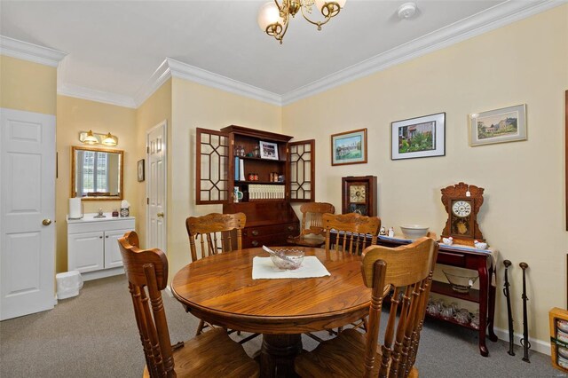 15 Mill St, Elsah, IL 62028 - dining space with carpet, a chandelier, ornamental molding, and baseboards