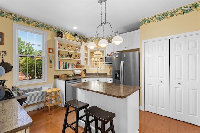 15 Mill St, Elsah, IL 62028 - kitchen with appliances with stainless steel finishes, a sink, light wood-style flooring, white cabinetry, and recessed lighting