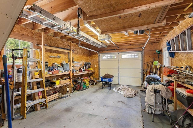 15 Mill St, Elsah, IL 62028 - garage featuring a garage door opener and a workshop area
