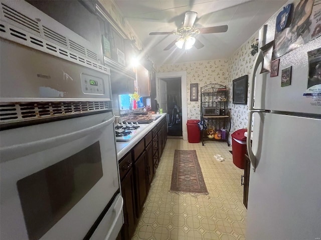 429 N Kennedy Blvd, Vandalia, IL 62471 - kitchen featuring white appliances, wallpapered walls, light floors, a ceiling fan, and light countertops