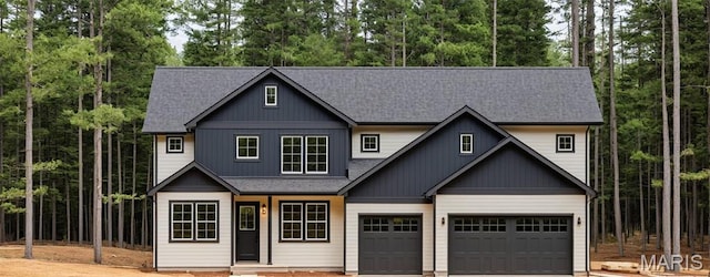 view of front facade featuring concrete driveway, roof with shingles, an attached garage, and covered porch