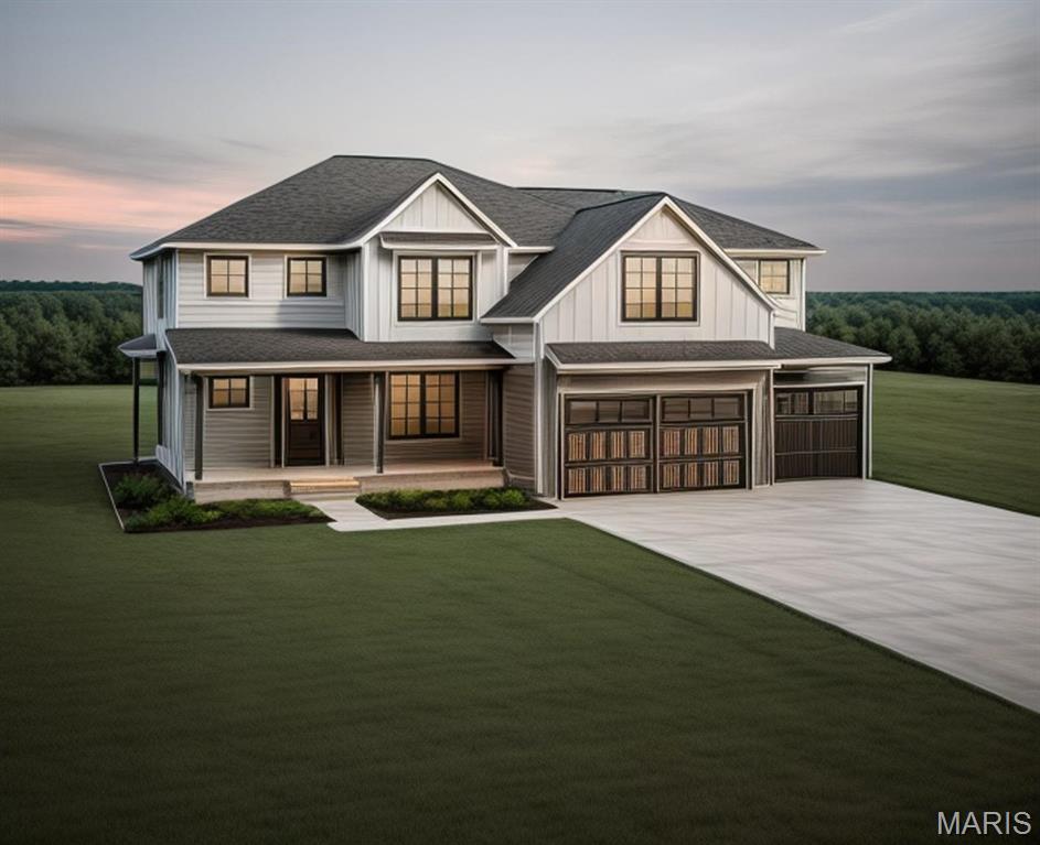 modern inspired farmhouse featuring covered porch, concrete driveway, board and batten siding, a lawn, and an attached garage