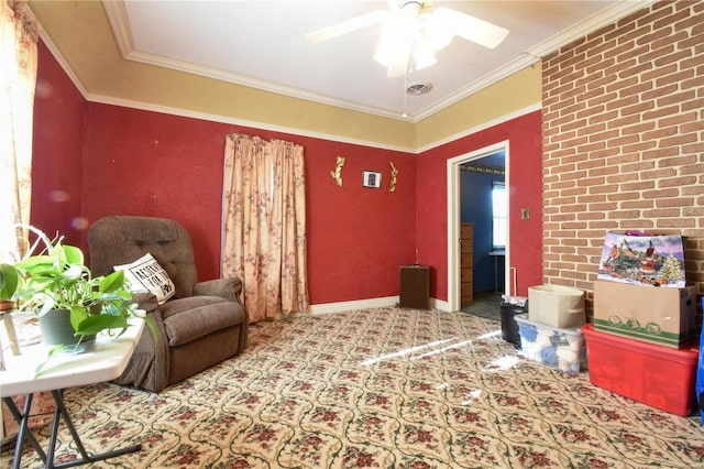 living area featuring carpet flooring, ceiling fan, ornamental molding, and baseboards