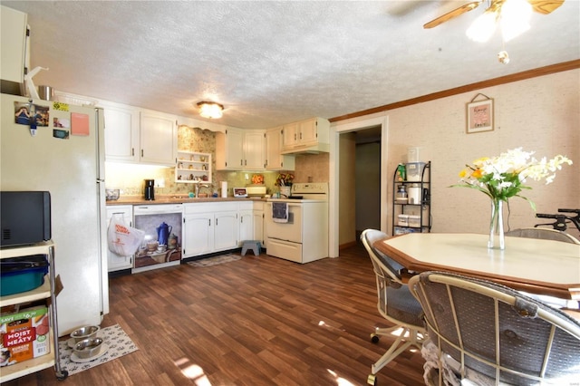 kitchen featuring white appliances, a textured ceiling, ornamental molding, white cabinets, and a ceiling fan