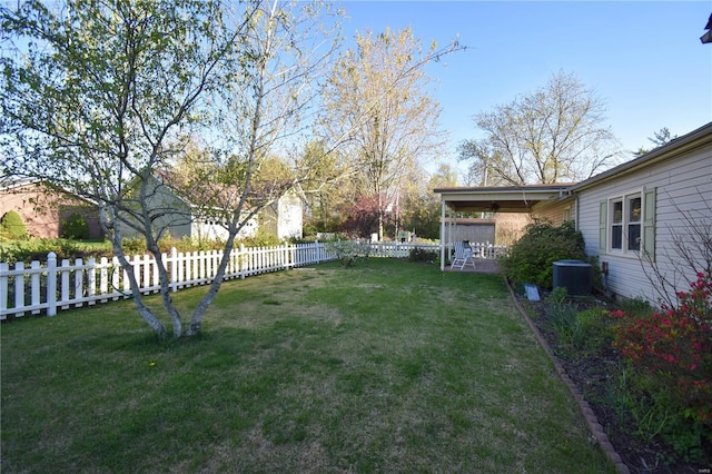 view of yard featuring central air condition unit, ceiling fan, and a patio area