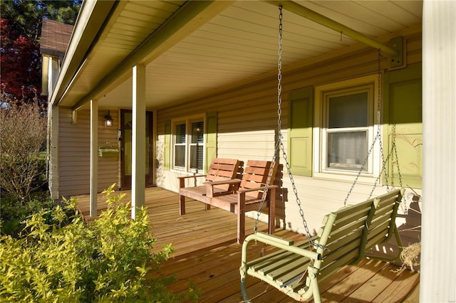 wooden terrace featuring a porch