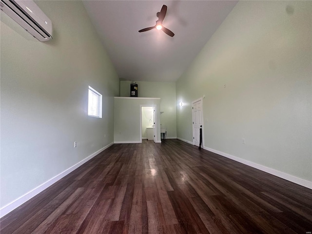 29455 State Highway Ac, Lebanon, MO 65536 - unfurnished living room with an AC wall unit, ceiling fan, dark wood-type flooring, baseboards, and high vaulted ceiling
