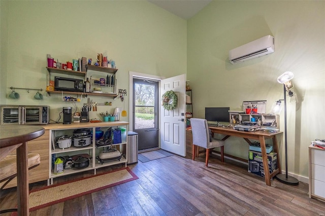 29455 State Highway Ac, Lebanon, MO 65536 - office area with a wall unit AC, wood finished floors, high vaulted ceiling, and baseboards