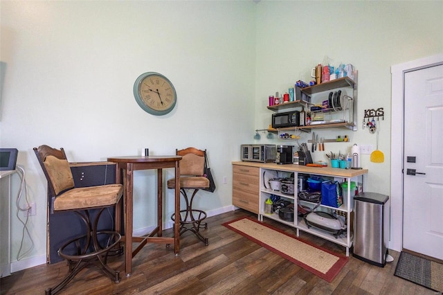 29455 State Highway Ac, Lebanon, MO 65536 - bar with dark wood-style flooring, baseboards, and black microwave