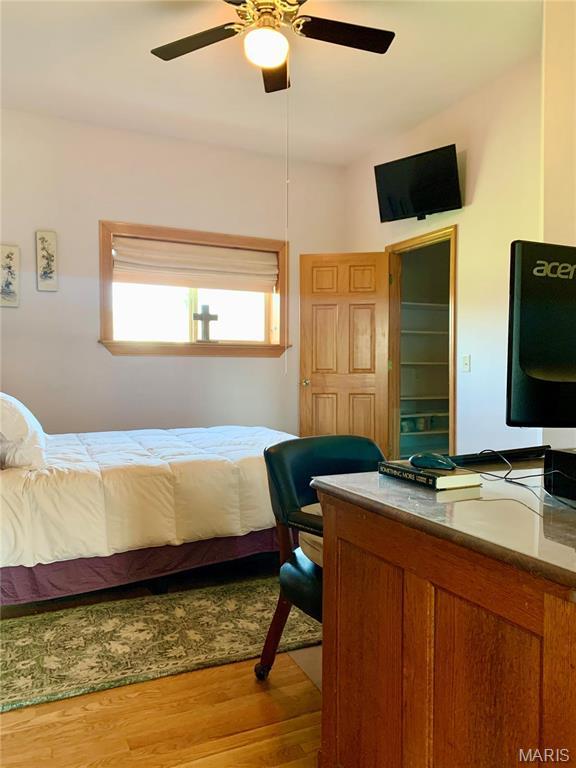 24613 Shady Oak Pl, Perry, MO 63462 - bedroom with wood finished floors and ceiling fan