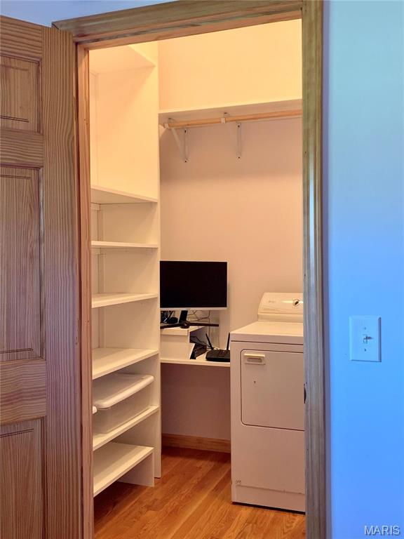 24613 Shady Oak Pl, Perry, MO 63462 - spacious closet with washer / dryer and light wood-type flooring