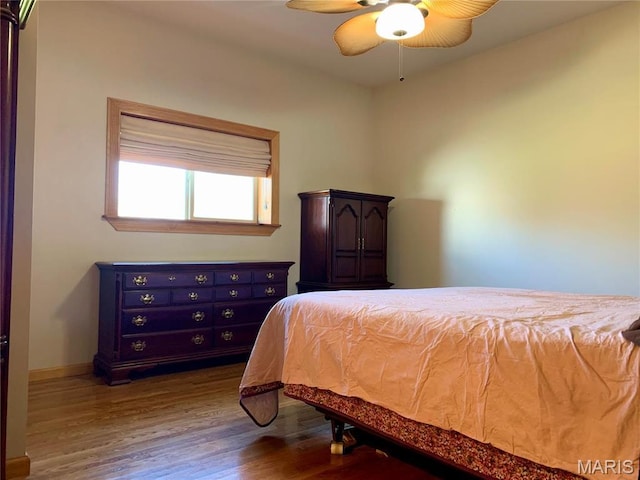 24613 Shady Oak Pl, Perry, MO 63462 - bedroom with wood finished floors and baseboards