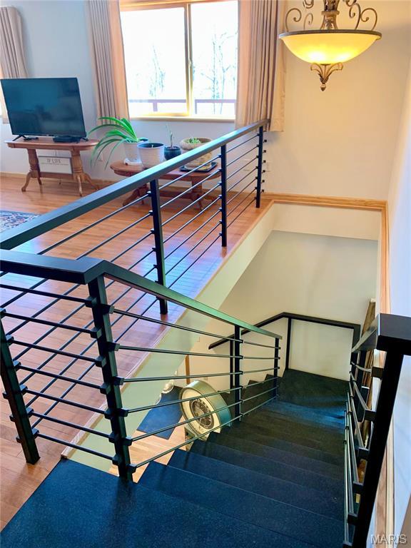 24613 Shady Oak Pl, Perry, MO 63462 - stairs with wood finished floors