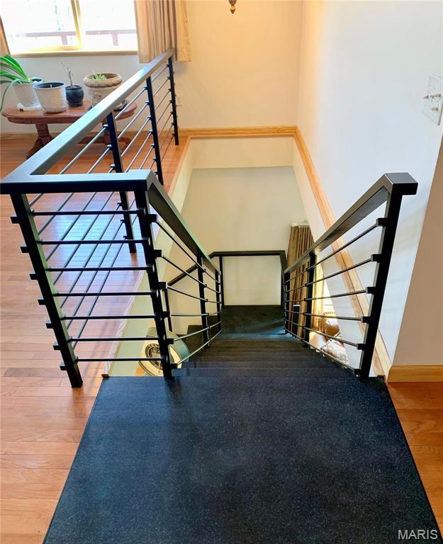 24613 Shady Oak Pl, Perry, MO 63462 - stairway with wood finished floors and baseboards