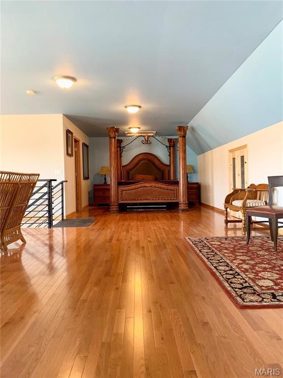 24613 Shady Oak Pl, Perry, MO 63462 - bedroom featuring light wood-style floors, vaulted ceiling, and baseboards