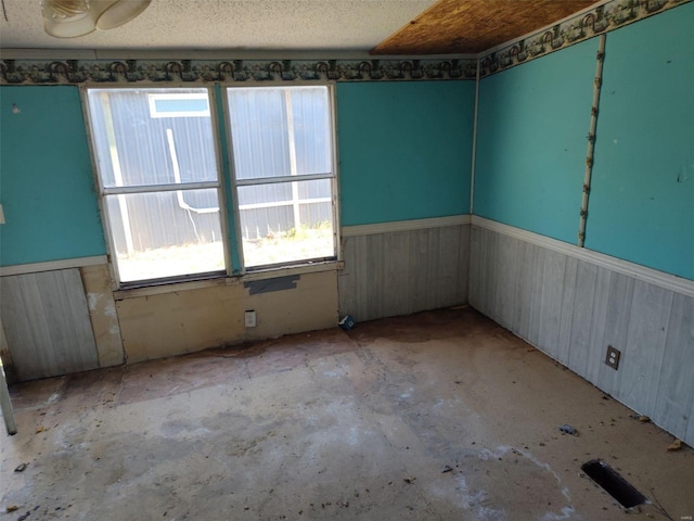 5226 Timber Lake Dr, Waterloo, IL 62298 - unfurnished room featuring a wainscoted wall, concrete flooring, and wooden walls