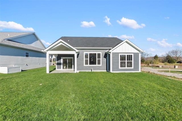 2640 Walden Blvd, Cape Girardeau, MO 63701 - rear view of property featuring a yard and board and batten siding