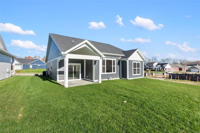 2640 Walden Blvd, Cape Girardeau, MO 63701 - back of property with a lawn, board and batten siding, central AC, and a shingled roof
