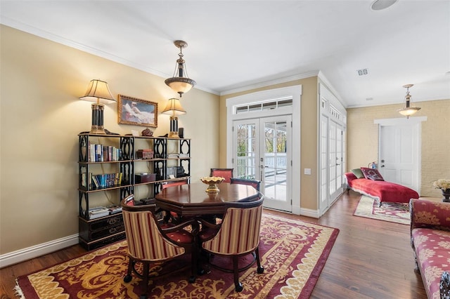 813 S 4th St, Clarksville, MO 63336 - dining space with crown molding, wood finished floors, baseboards, and french doors