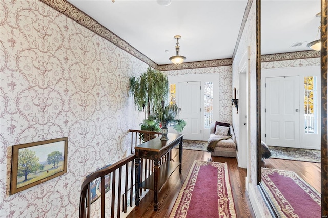 813 S 4th St, Clarksville, MO 63336 - entrance foyer with wallpapered walls and wood finished floors