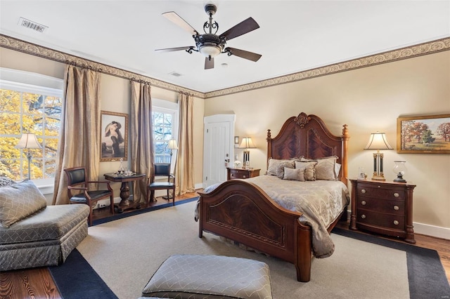 813 S 4th St, Clarksville, MO 63336 - bedroom featuring wood finished floors, baseboards, and a ceiling fan