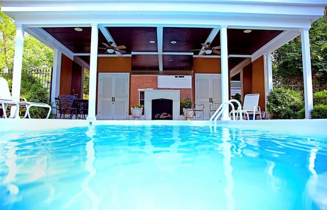 813 S 4th St, Clarksville, MO 63336 - swimming pool featuring ceiling fan, an outdoor fireplace, and a gazebo
