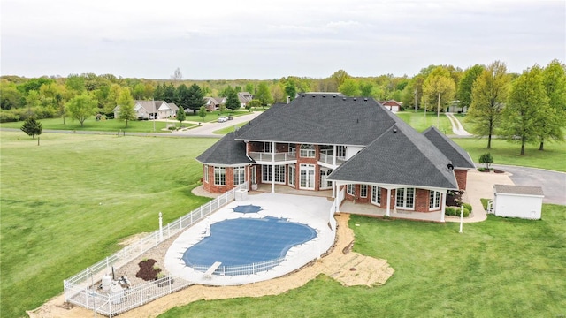 back of house with a balcony, a covered pool, french doors, brick siding, and a shingled roof