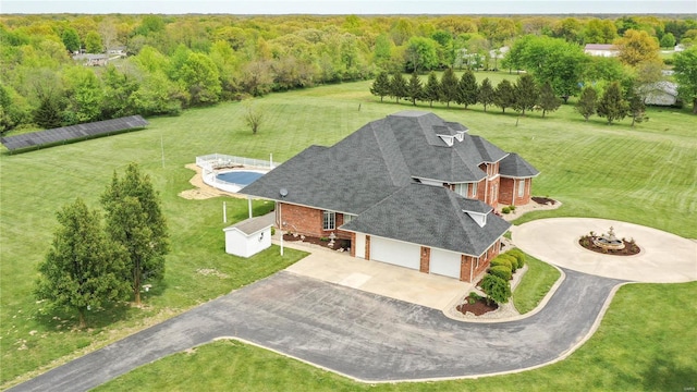 view of subject property featuring a heavily wooded area