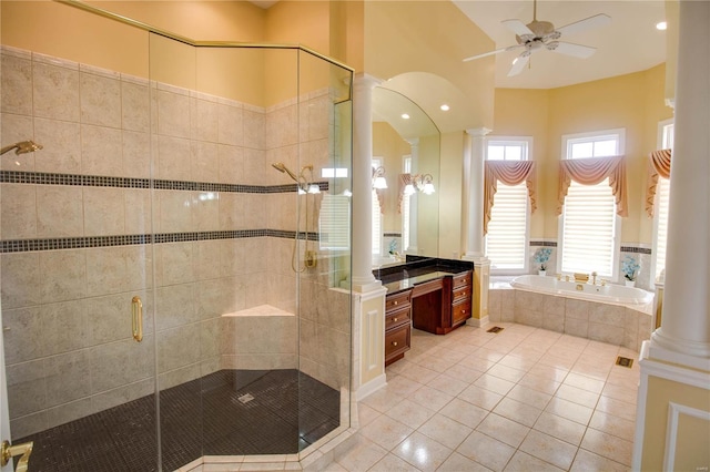 bathroom with decorative columns, a garden tub, a ceiling fan, tile patterned floors, and a shower stall