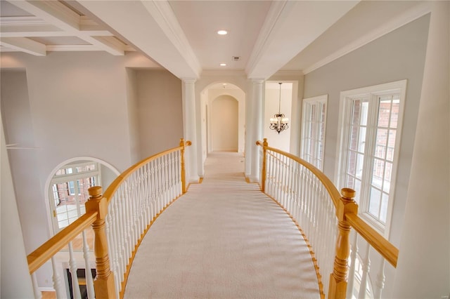 corridor with an upstairs landing, ornamental molding, carpet floors, a chandelier, and recessed lighting