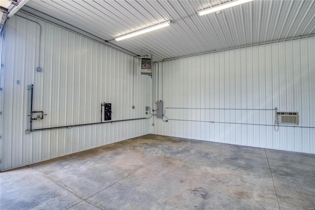 garage featuring an AC wall unit