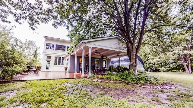 16093 Hwy W, Clarksville, MO 63336 - rear view of house featuring a ceiling fan and a deck